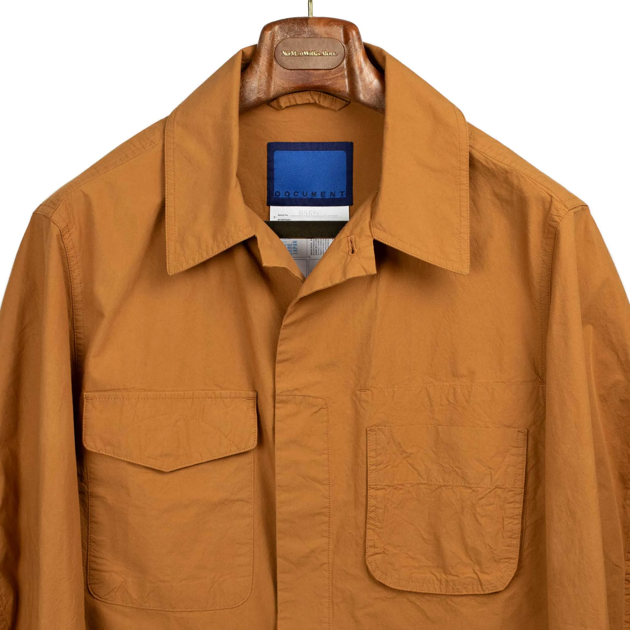 Patch pocket jacket in lightweight burnt orange typewriter cotton